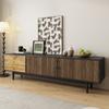 TV Cabinet, Lowboard with Door Panels with Water Wave Pattern and Three Drawers In a Wood and Black Color Scheme.