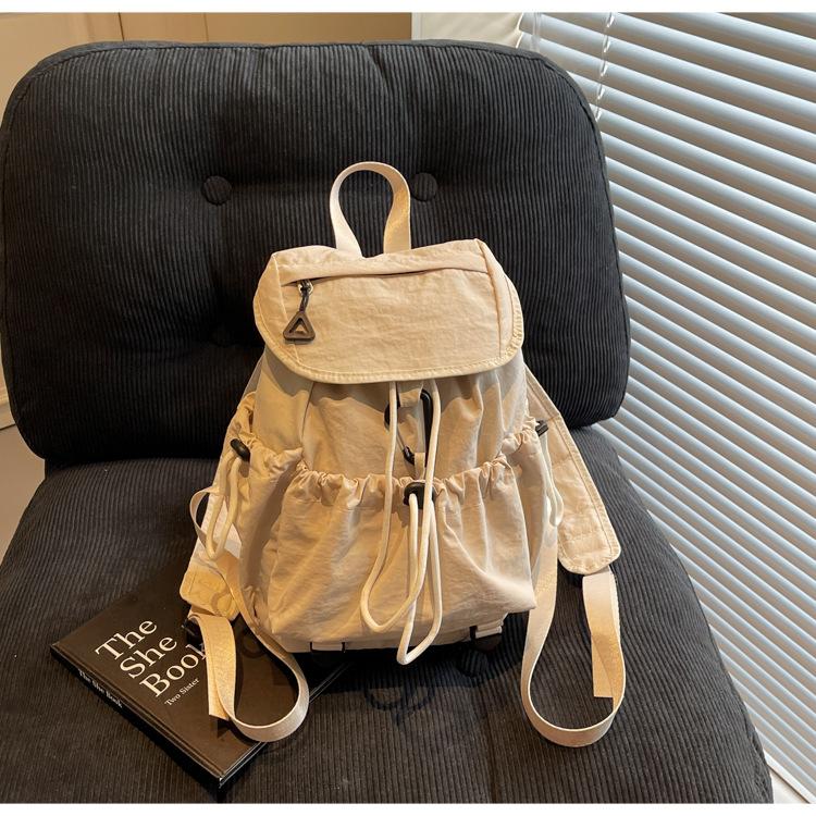 

2025 новый плиссированный рюкзак из нейлона с веревочным затягиванием, женский, нишевый тренд, большая вместимость, рюкзак-флип, студенческий рюкзак хаки