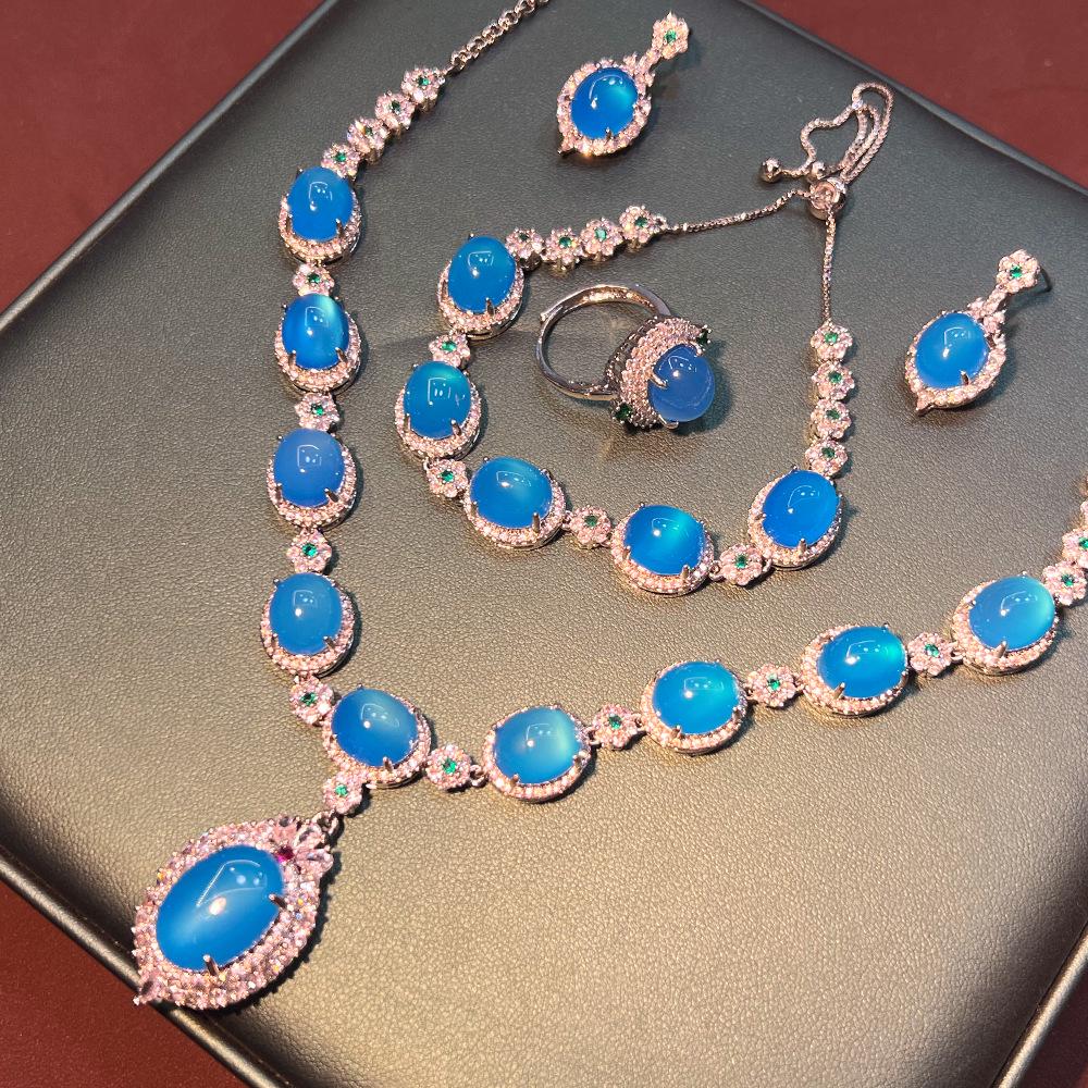 Juego de Joyería Vintage Chino de Calcedonia Zafiro: Colección de Lujo de Cuatro Piezas de Plata Chapada en Cobre