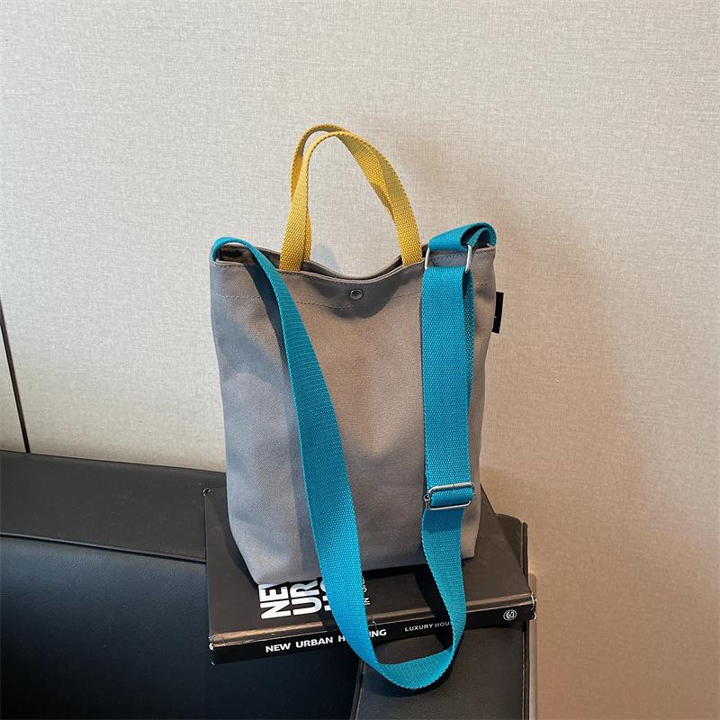 Portable shoulder tote cloth bag women's new simple commuting design sense niche large-capacity leisure bucket bag