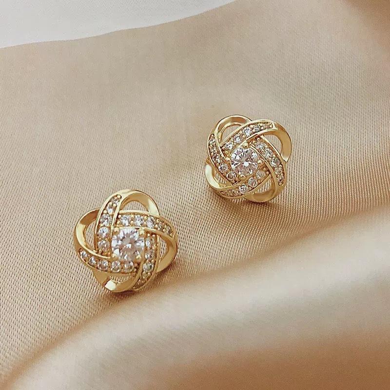 

Golden simple spiral stud earrings women s earrings unique new popular high-end temperament light luxury earrings