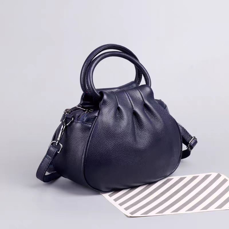 Bolsa Feminina de Couro Genuíno 2025 Nova Retrô Couro Bovino Camada Superior Bolsa de Mão Simples Versátil Tote Fabricante