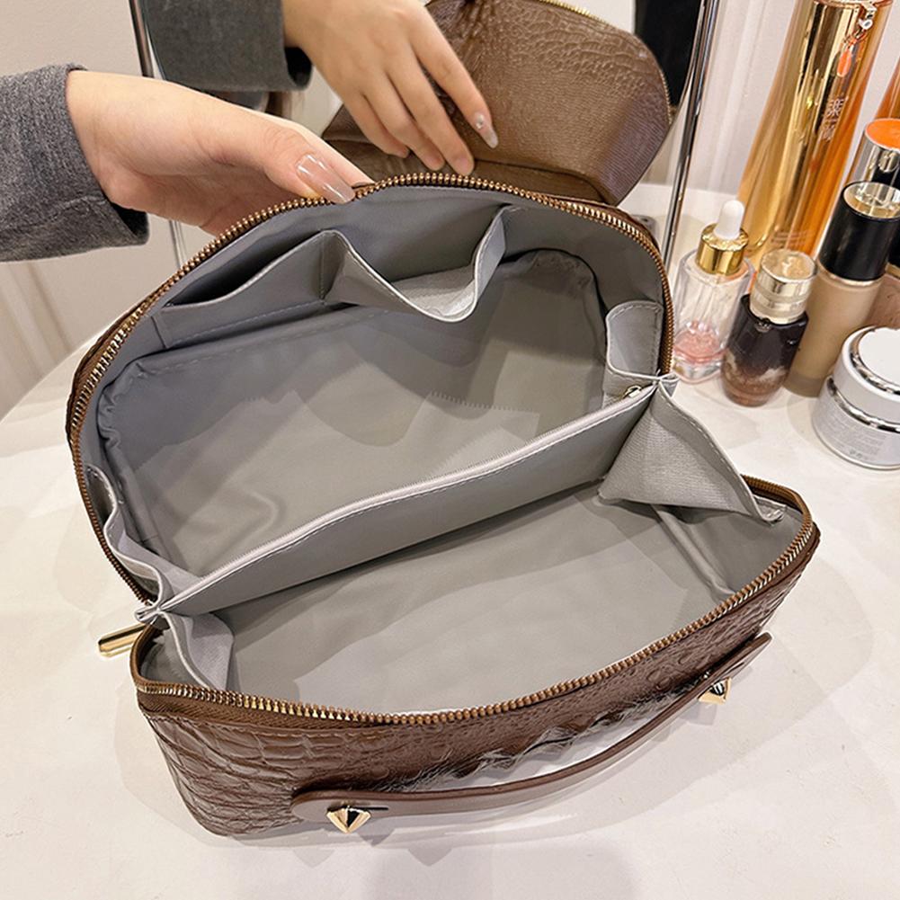 Kaufe beliebte Schminktasche mit Schlangenhautmuster