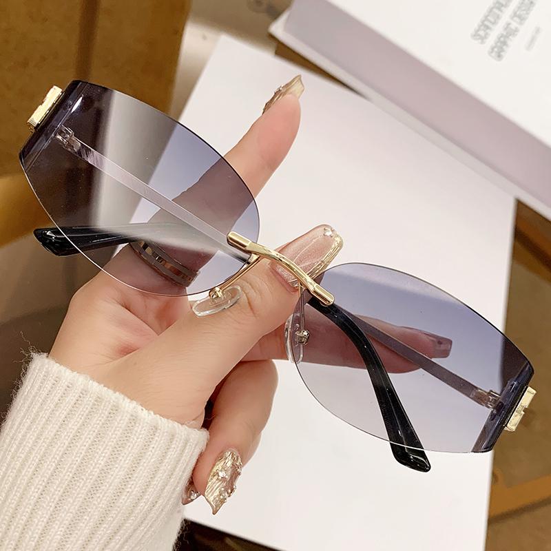New Fashionable Sweet And Cool  Girl Metal Frameless Sunglasses Curved Small Frame Uv Edge Cutting Sunglasses