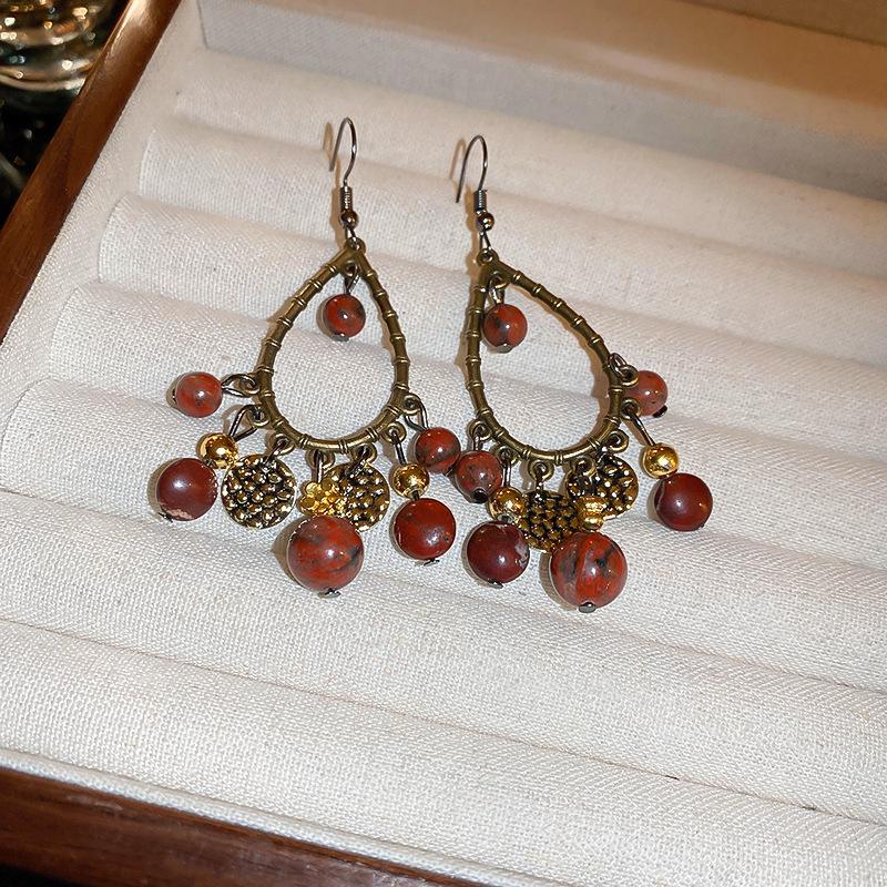 Vintage Quastenohrringe aus Silbernadel: Elegantes Wassertropfendesign mit einem Retro-literarischen Touch