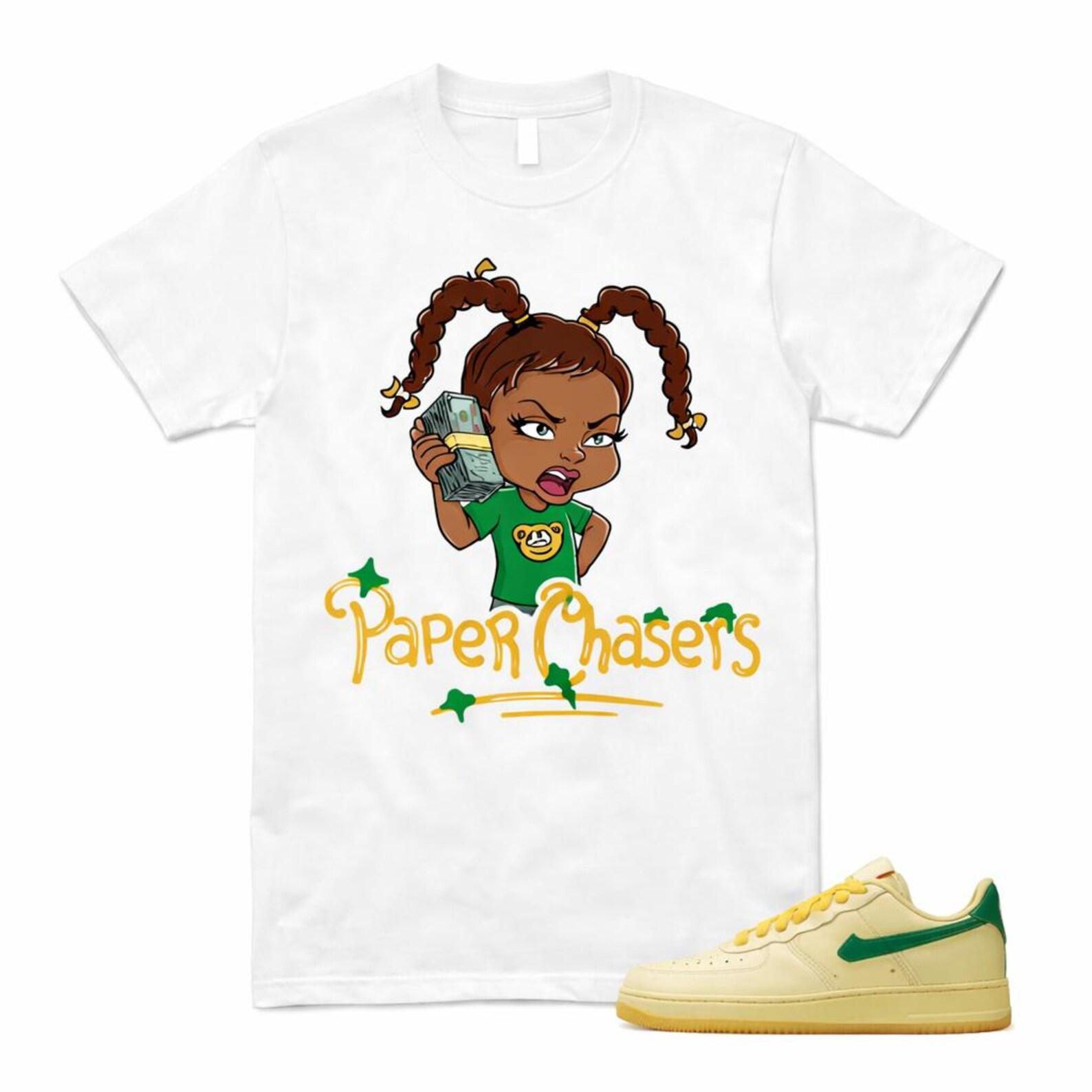 Paper Chasers Graphic Tee – Cartoon Hustle Girl Illustration Streetwear T-Shirt 2XL