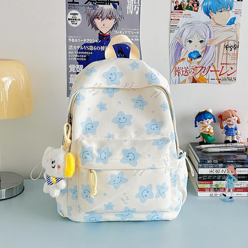 Nowy tornister jest wysokiej jakości, świeży, słodki i uroczy, a plecak w gwiazdki to lekki plecak podróżny dla uczniów gimnazjum.