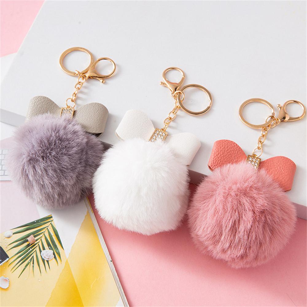 Modny breloczek z pomponem Kreatywny brelok do kluczy z PU w kształcie kokardy z błyszczącymi cyrkoniami Ozdoby do damskiej torebki Akcesoria do uchwytu na klucze samochodowe