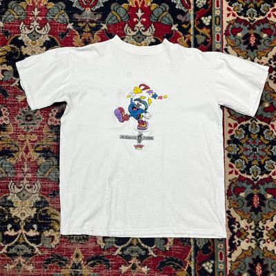 Titul: Vintage tričko Atlanta Olympics 1996 Maskot Izzy Bílé Tričko Hry USA Velikost M