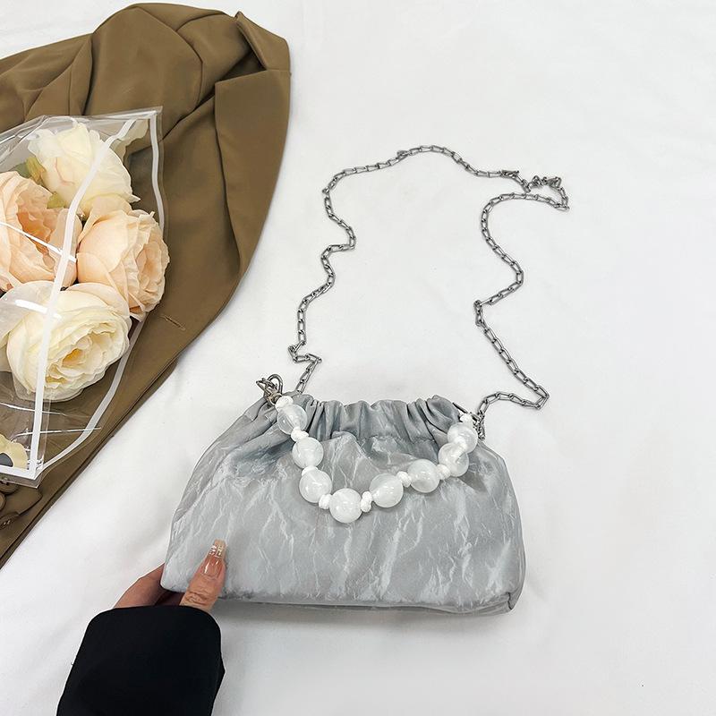 

Foreign style fashionable simple beaded handbag 2025 spring and summer new versatile ins shoulder messenger bag bucket bag women серый