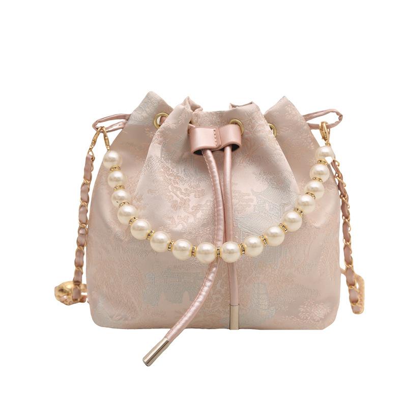 

Hand carry pearl bucket bag women s spring new Chinese embroidered shoulder bag simple texture messenger bag розовый
