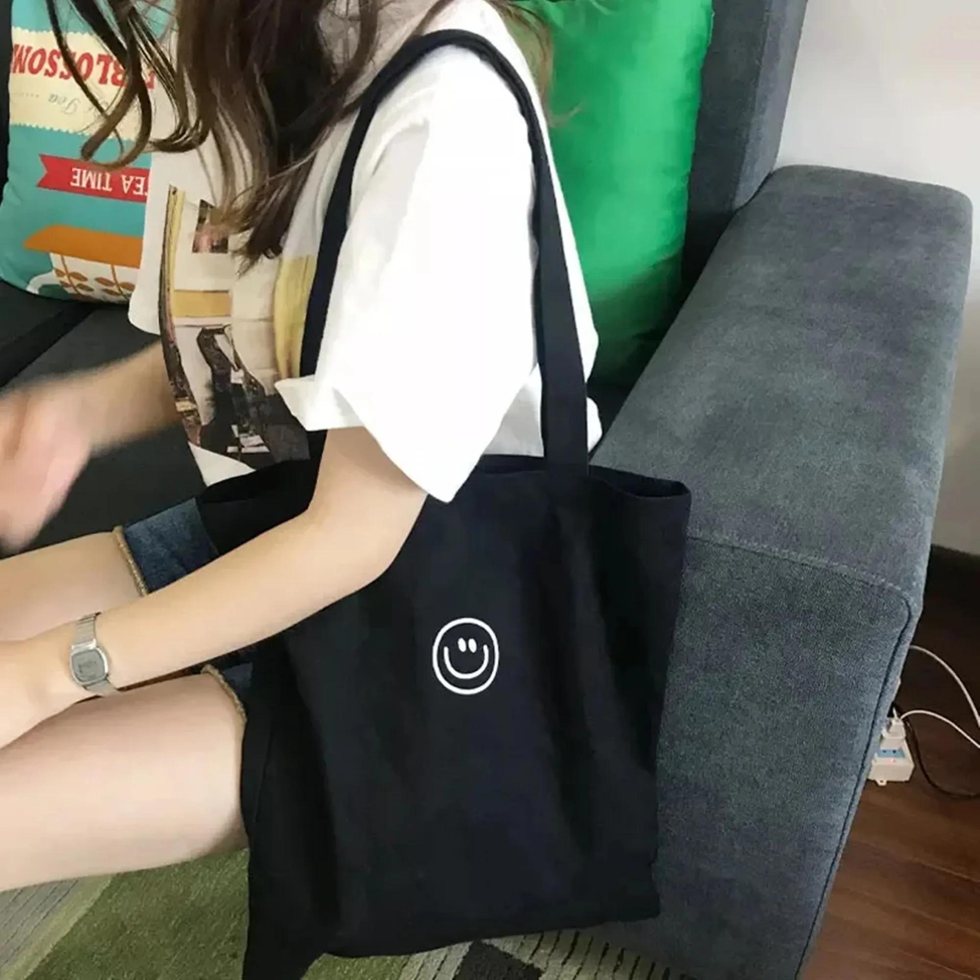 

Женская холщовая сумка через плечо с принтом улыбающегося лица, женская повседневная сумка-тоут, многоразовая сумка для покупок, пляжа и путешествий чёрный