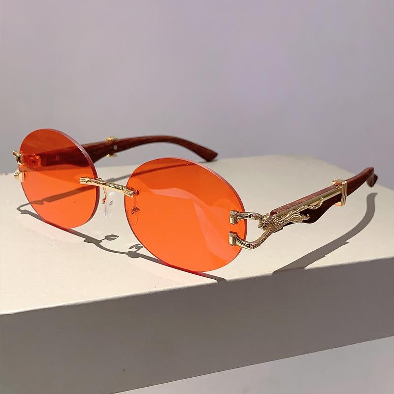 

Luxury Brand Designer Vintage Rimless Oval Sunglasses Women For Men Sun Glasses Trendy Punk Popular Metal Leopard Eyeglasses