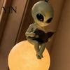 Indoor Outdoor Statue Alien Reading on Moon Hanging Lamp, Resin Bookshelf Light, Gift for Space Lovers Warm LED Night Light Decor Patio Garden Window