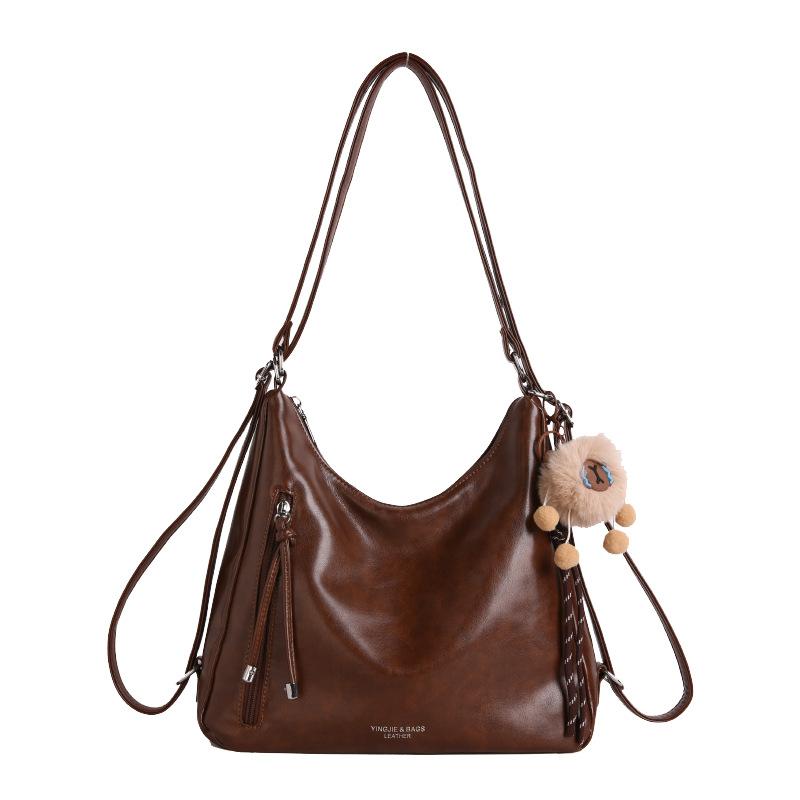 

Korean version retro large-capacity tote backpack women s winter new light luxury niche daily portable messenger bag