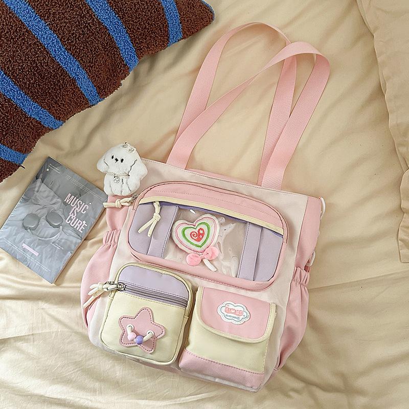 

The new Korean version ins contrasting color splicing shoulder is fresh, sweet and transparent, and the bag for primary and secondary school students single bag free lollipop. розовый