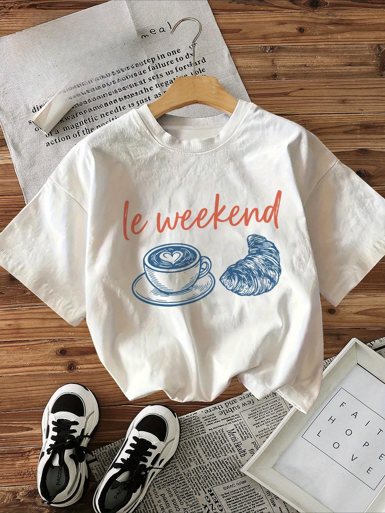 

Le Weekend Graphic TShirt Womens Short Sleeve Crew Neck Casual Top Coffee Croissant Print with Orange Lettering Printed Tee S