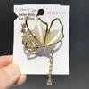 French Light Luxury Butterfly Brooch with Cat's Eye Tassel for Suits