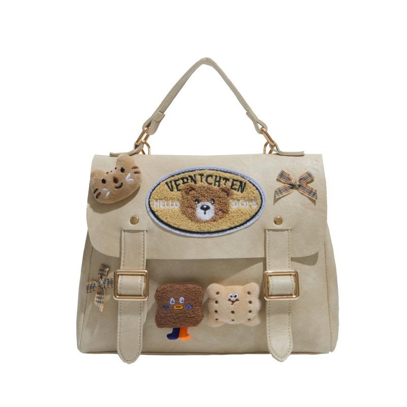 Schoolbag Korean version backpack bag women's American retro handbag 1011 spring new cute letter bear casual bag women