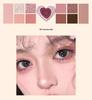 Heartbeat Twelve-Color Heart-Shaped Eyeshadow Palette: Pearlescent, Fine Glitter, Matte, Blush, Highlighter for Enhanced Complexion.