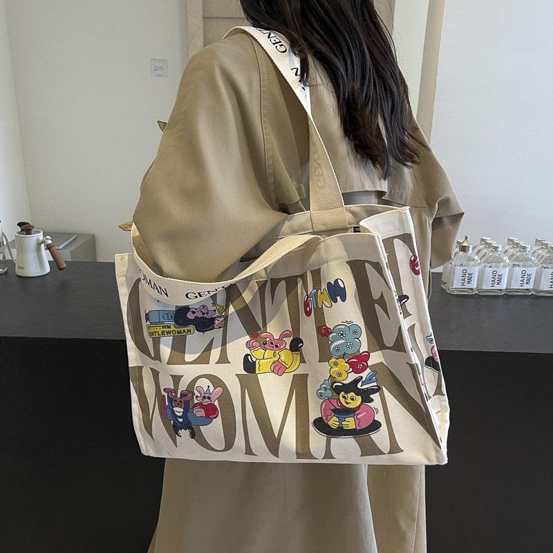 Canvas bag women's large capacity 2025 new bag portable commuter bag casual fashion fresh bag single shoulder mommy bag