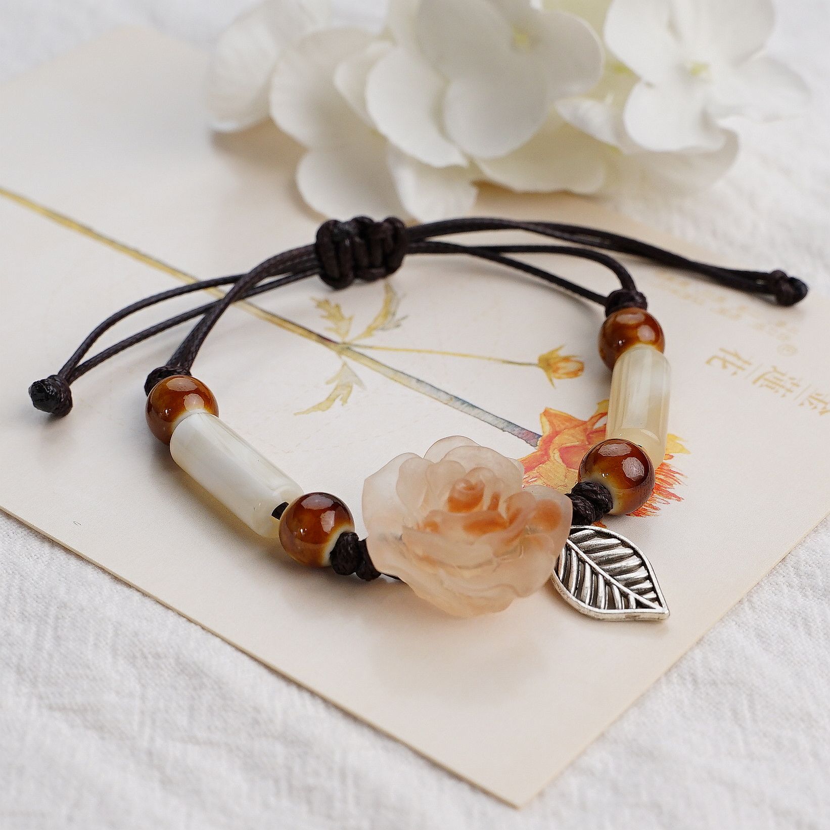 

Camellia woven bracelet women s wholesale original design niche Jingdezhen ceramic jewelry ethnic style hand rope jewelry