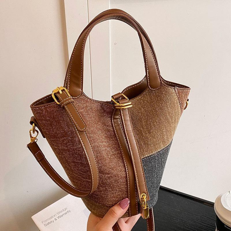 2025 new Korean version of literary personality splicing denim portable bucket bag fashionable versatile commuter messenger bag