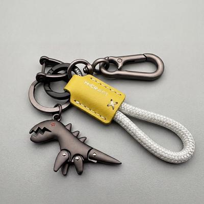Adorable Porte-clés Dinosaure Dessin Animé avec Sangle en Cuir - Parfait pour les Sacs à Dos, les Voitures, ou comme Cadeau Charmant