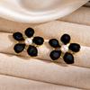 Fashionable Titanium Steel Pearl Flower Stud Earrings for Women: Stylish Stainless Steel Hollow Design in Cold Style.