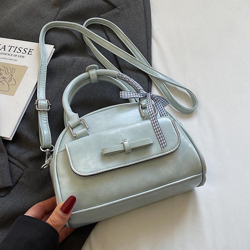 

Популярная простая нишевая портативная сумка для боулинга из Южной Кореи, высококлассная текстура, стиль балета, универсальная сумка-мессенджер для通勤, женская