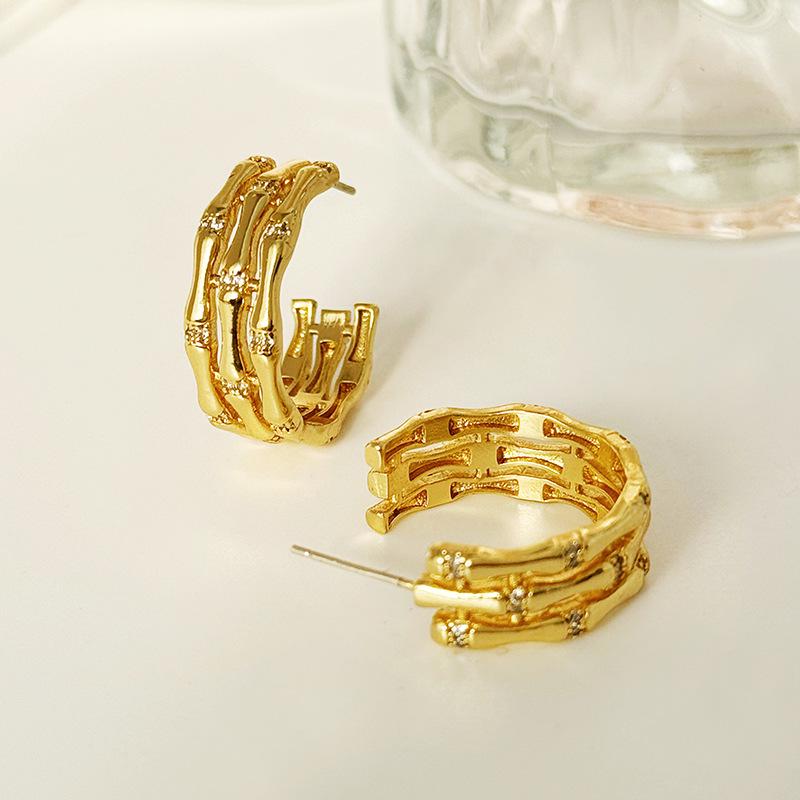 

European & American Gold Bamboo Joint Hoop Earrings: Light Luxury, Multi-layered, Hollow Design for Women.