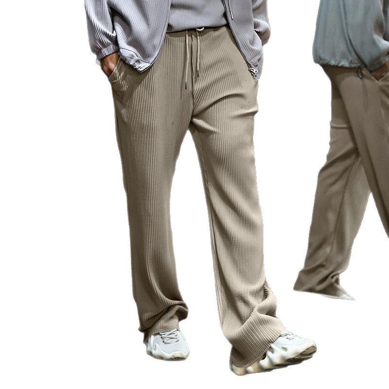 European size spring and autumn jacquard striped wide-leg men's pants casual loose pit strip drawstring straight large size trousers men