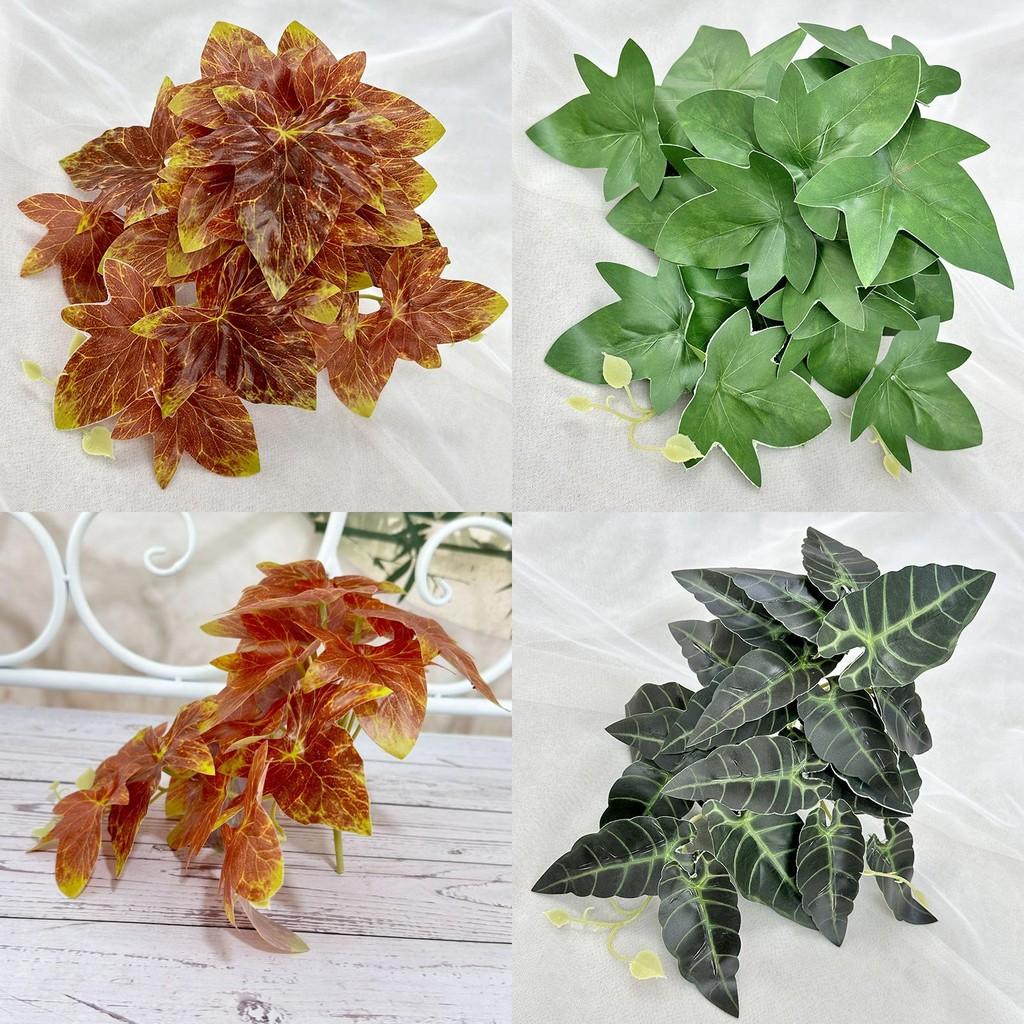 S zeleň bonsajových javorových a alokáziových listů pro výzdobu hotelového pokoje