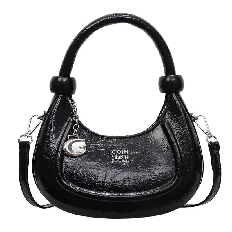 

Niche design bag women s new trendy and popular versatile messenger bag temperament simple portable crescent bag чорний