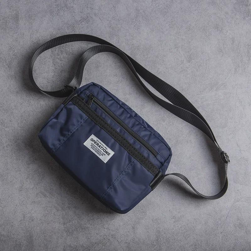 Herren Oxford Stoff Lässige Messenger Umhängetasche: Neuer Trend in der amerikanischen Street Fashion.