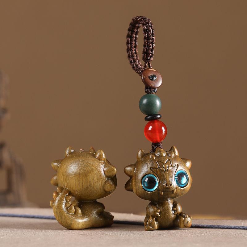 Twelve Zodiac Animal Charms Green Sandalwood Set: Rat, Ox, Tiger, Rabbit, Dragon, Snake, Horse, Sheep, Monkey, Rooster, Dog, Pig.