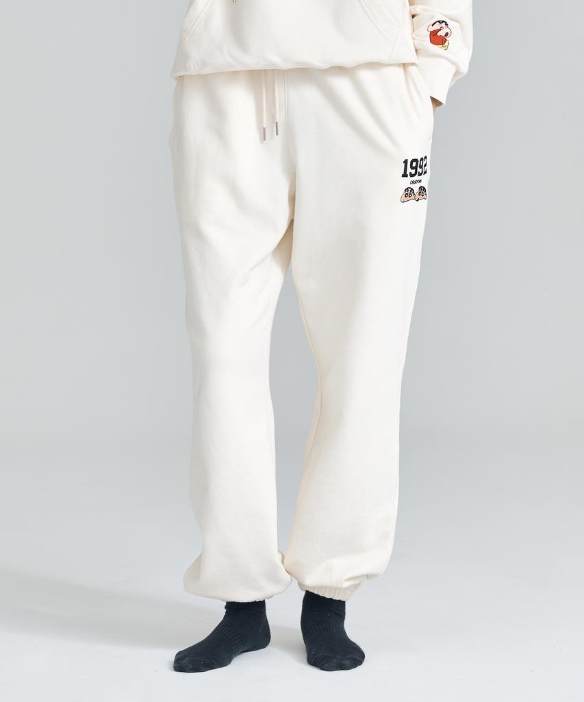 Daenkkomma Crayon Shin-Chan 1992 Face Embroidery Sweatpants (Black, Cream)