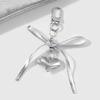 Heart Embellished Silver Leather Bowknot Key Rings Unique Accessory for Backpacks and Purses for the Modern Woman