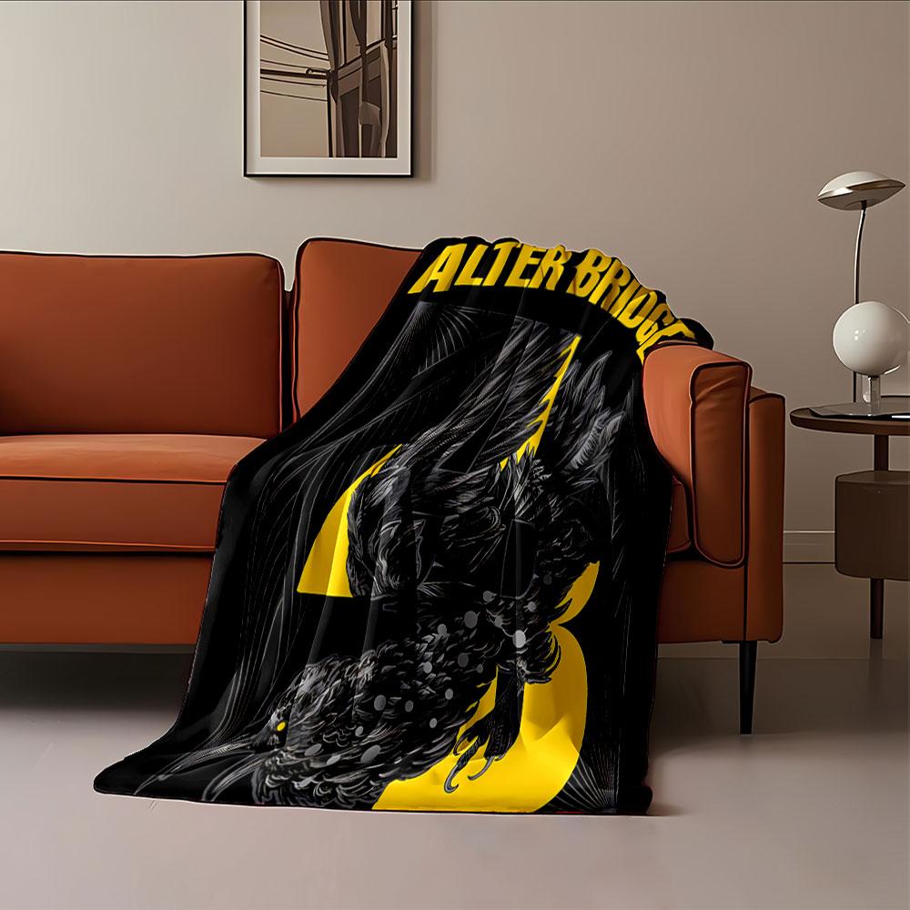 A stylized black bird entwined with yellow text and abstract line art. for all seasons blanket lunch break throw gift