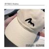 Embroidered baseball cap, lightweight and breathable for outdoor activities, designed to enhance facial features with a simple and stylish look