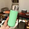 Miniature compact insulated cup with magnetic lid for making tea. Portable outdoor sports insulated drinking water bottle.
