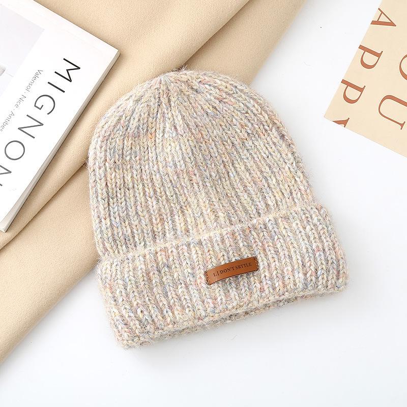 Autumn and winter pullover warm wool hat women's fashion leather label knitted confinement hat outdoor cycling sports hat