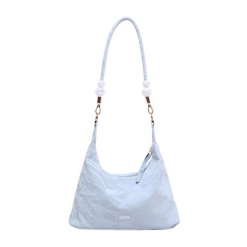 

Текстурована сумка великого обсягу під пахвами. Популярна жіноча сумочка з бісером цього року. Універсальна сумка через плече. синій