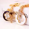 Elegant Diamond-Studded Four-Leaf Clover Keychain: Perfume Bottle Bag Charm for Women