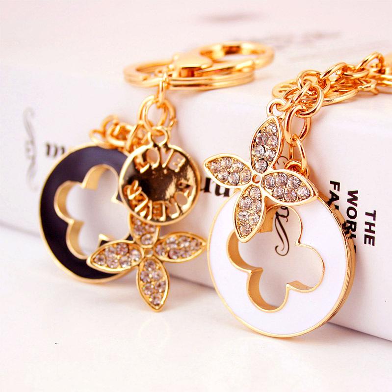 Elegant Diamond-Studded Four-Leaf Clover Keychain: Perfume Bottle Bag Charm for Women
