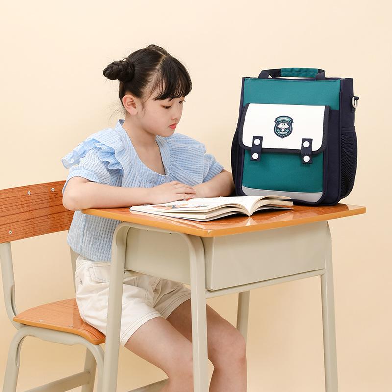 New lightweight tutoring bag boys and girls color matching large-capacity children's multi-functional double shoulder tutoring bag primary school bag