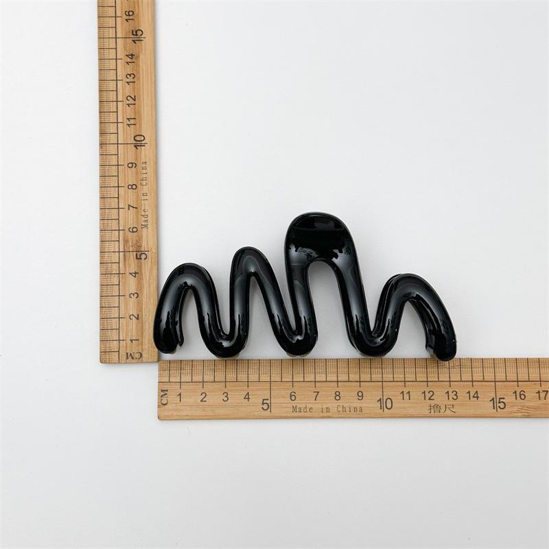 Fluid Wave Silhouette Hair Clip In Dreamy Translucent Hues Provides Secure Hold For Messy Buns And Modern Minimalist Updos