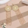 Ethnic Style Tassel Earrings with Hollow Flower Design