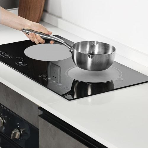 KR KITCHENRAKU induction cooktop mat, 2-piece set, protects stove from scratches, prevents burns, and is non-slip for induction cooktops. Washable and