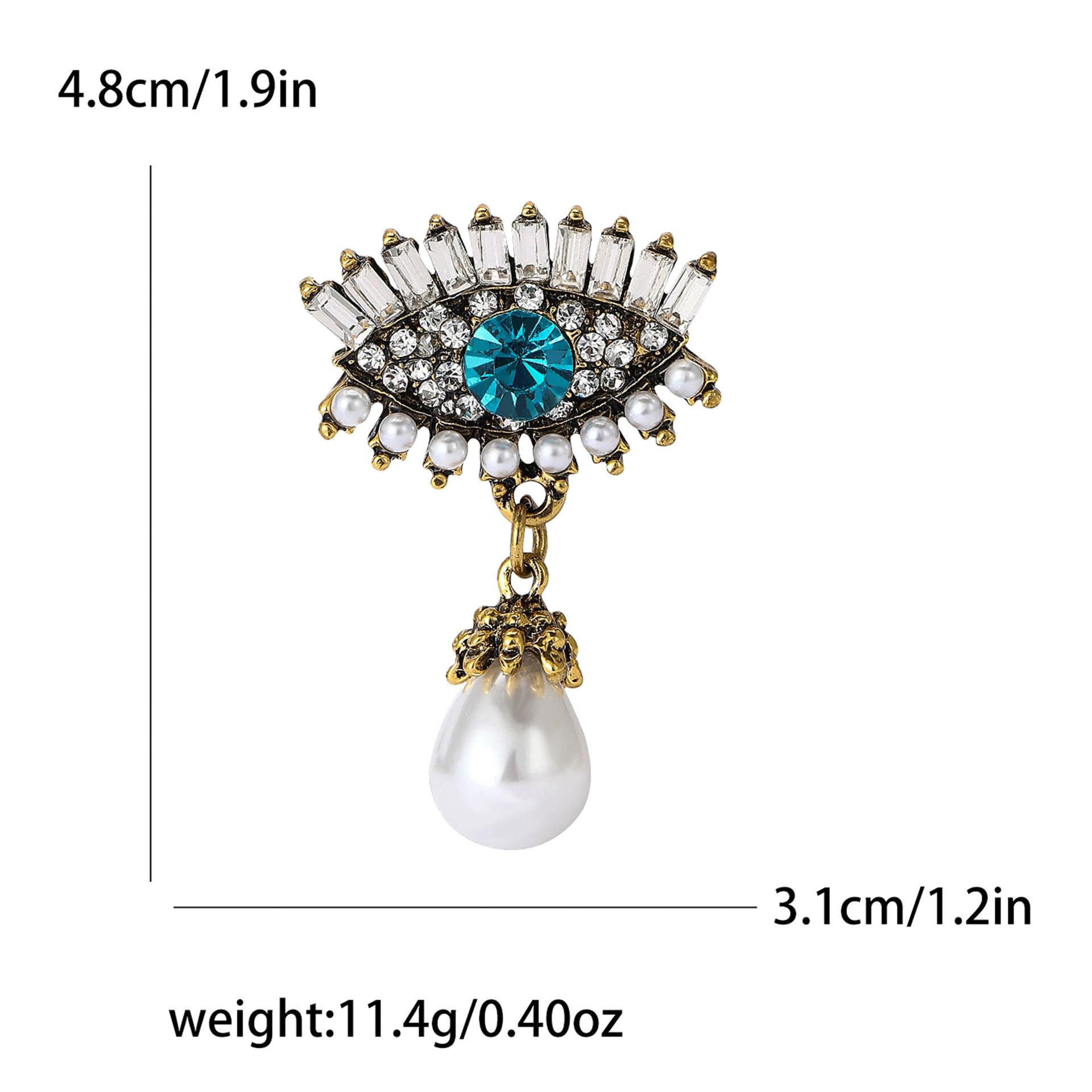 

Розкішна брошка-підвіска зі стразами «Око диявола» з перлинами